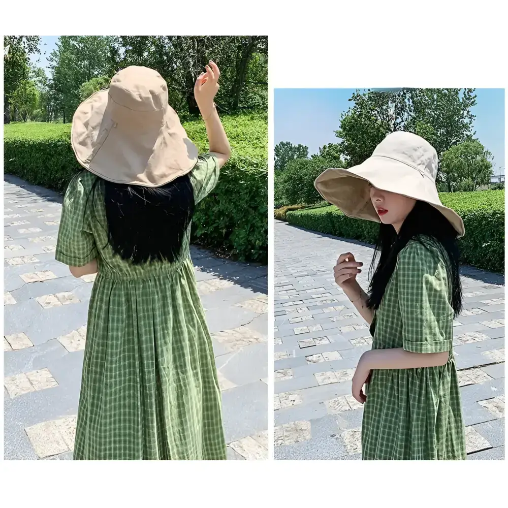 Beige UPF 50 sun protection hat paired with a green checkered dress in a sunny outdoor setting