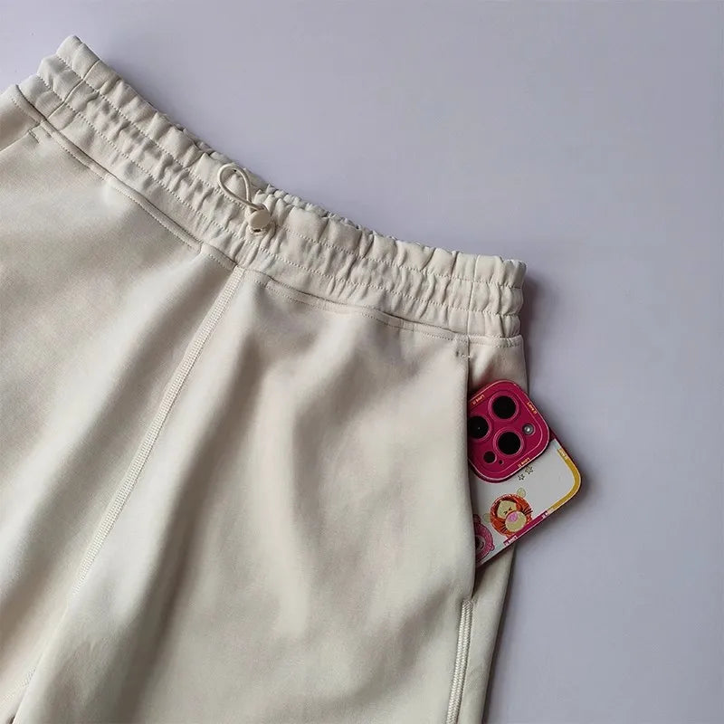 Light beige Casual Sports Shorts for Women with elastic waistband and side pockets for convenience