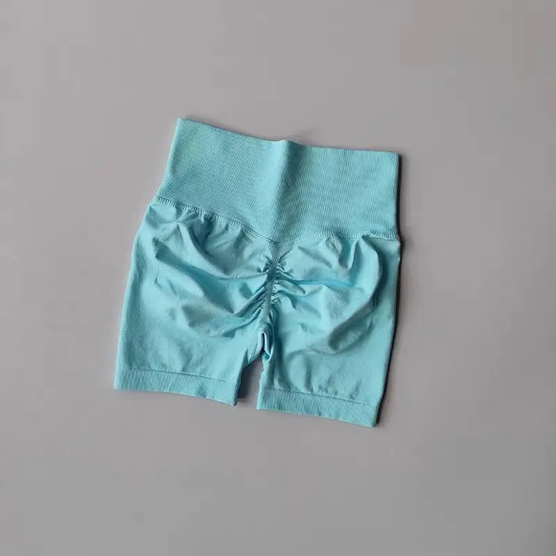 Light blue high-waist yoga shorts women with a stylish ruched back design for comfortable workouts