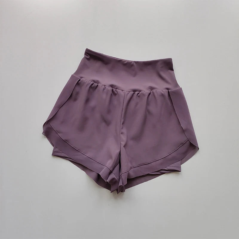 High-waisted sports shorts women in lavender color with side pockets for comfort and style