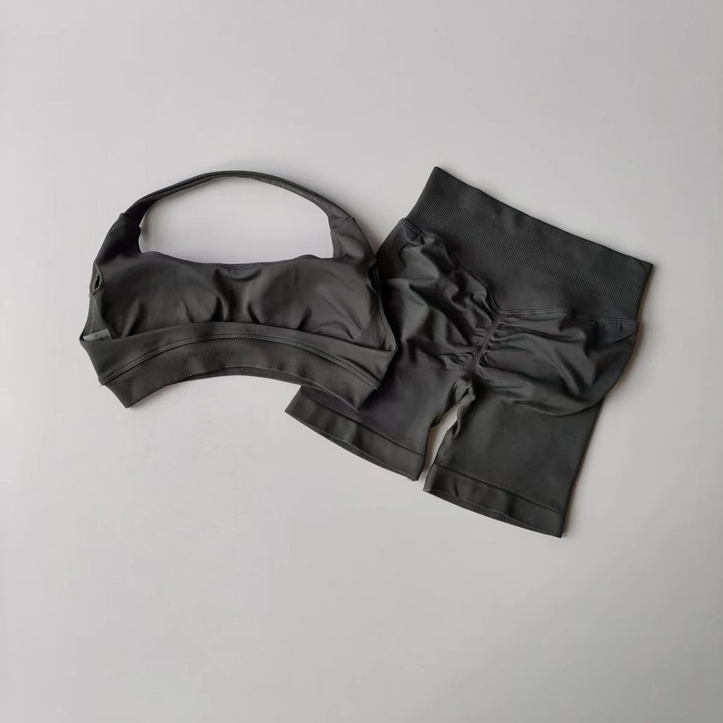 Ladies fitness outfit matching set in dark gray featuring a cropped top and high-waisted shorts