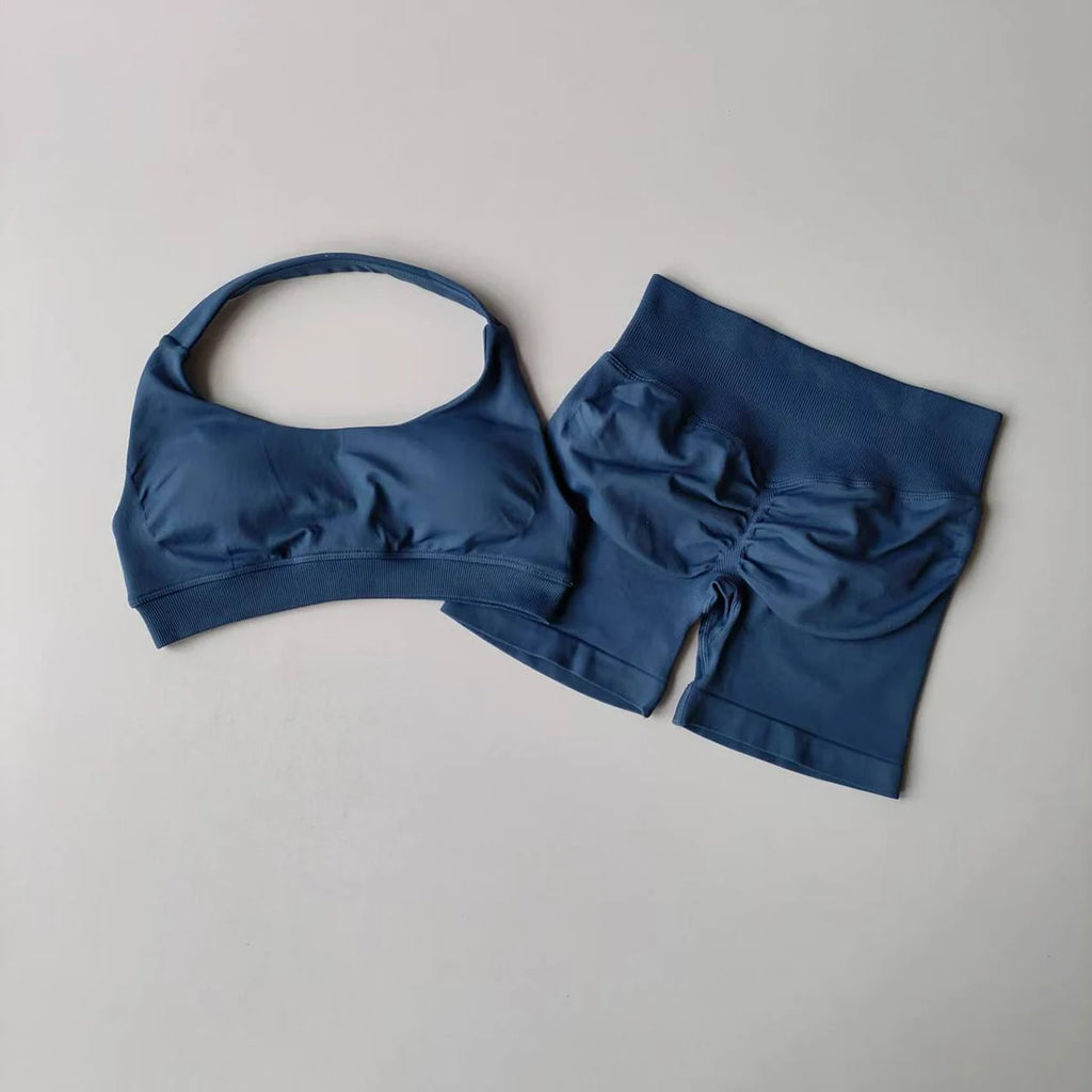 Seamless yoga suit for women in navy blue, featuring a sports bra and high-waisted shorts