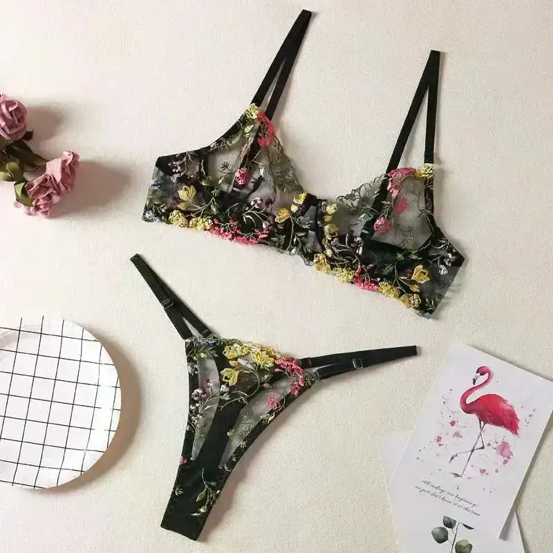 Floral embroidery lingerie set in black with colorful floral patterns and delicate straps